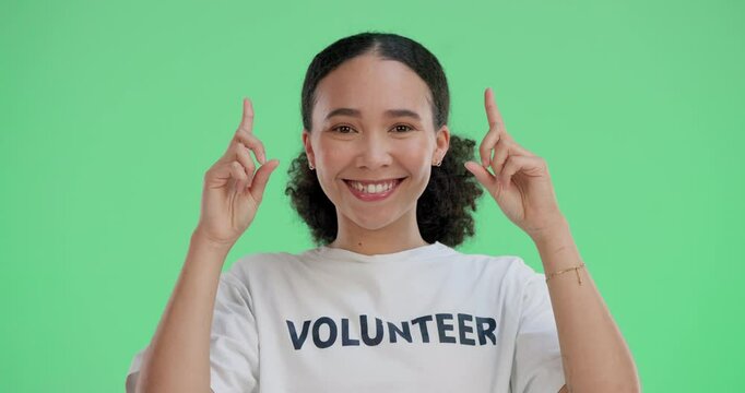 Volunteer, face and woman on green screen pointing for information, website details or choice in studio. Help, NGO and person with gesture for decision, charity donation or community development