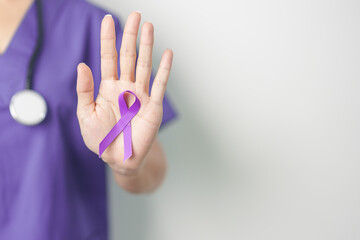 Doctor holding purple Ribbon for Violence, Pancreatic, Esophageal, Testicular cancer, Alzheimer,...