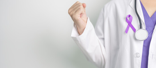 Doctor holding purple Ribbon for Violence, Pancreatic, Esophageal, Testicular cancer, Alzheimer,...