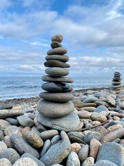 A pyramid of stones on the shore of Lake Baikal, a place of power, the soul of a pilgrim