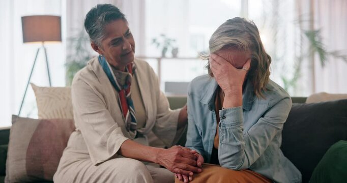 Senior couple, women and crying for comfort, support and relationship in living room with love or care. Elderly people, embrace and sad in house for LGBTQ, empathy and gay partner with helping hands