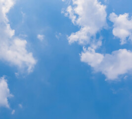 Fototapeta premium clear blue sky background,clouds with background, Blue sky background with tiny clouds. White fluffy clouds in the blue sky. 