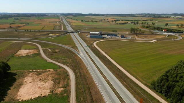 Panoramic drone view of expressway S8 highway road through agricultural fields