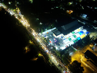 Night aerial view of a city highway with dense traffic