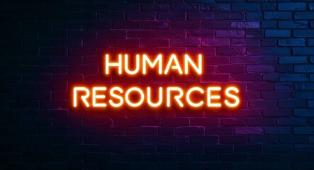 Obraz premium human resources word lettering glowing with neon light on dark brick wall background