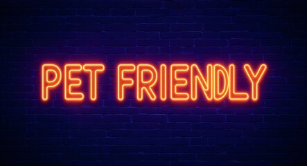 Obraz premium pet friendly word lettering glowing with neon light on dark brick wall background