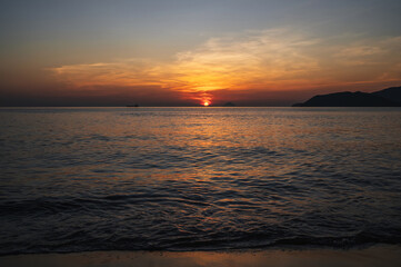 Obraz premium Landscape with orange sunrise in the morning at the sea in summer at a resort in Asia