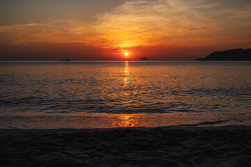 Obraz premium Landscape with orange sunrise in the morning at the sea in summer at a resort in Asia