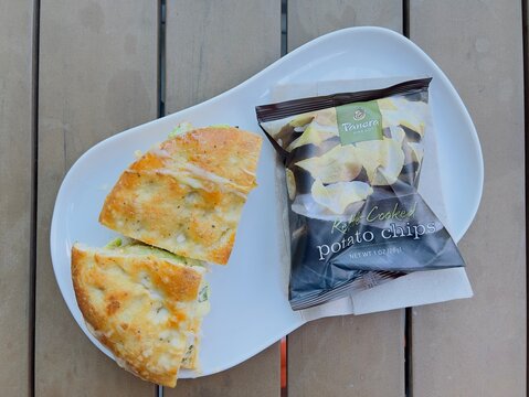 Panera bread hot panini sandwich and potato chips.