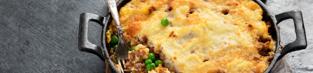 Shepherd’s Pie - ground meat with vegetables, topped with mashed potatoes, and cheese. Baked.