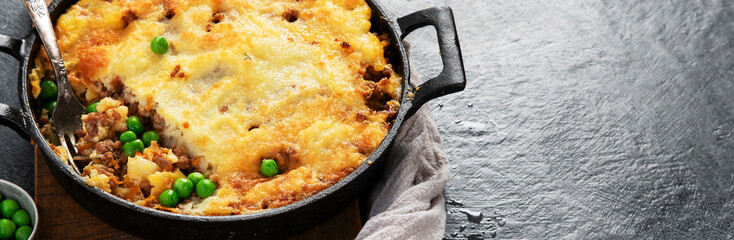 Shepherd’s Pie - ground meat with vegetables, topped with mashed potatoes, and cheese. Baked.