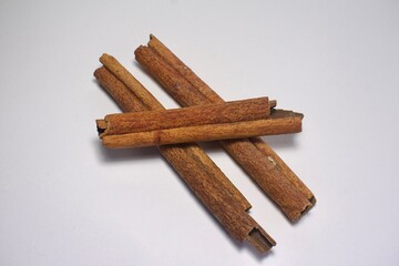 cinnamon sticks on white background
