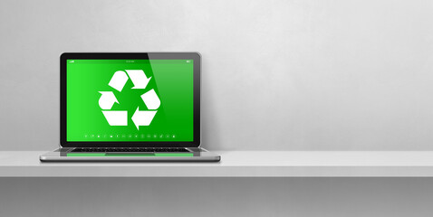 Laptop computer on a shelf with a recycling symbol on screen. environmental conservation concept