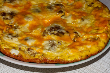 Omelette with meat and cheese for breakfast