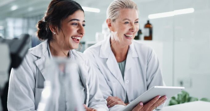 Team, scientist and happy women with tablet for research, innovation and chemistry with lab assistant. Medical, science and collaboration on computer for exam, biotechnology and laughing with mentor