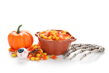 Halloween composition with toys and candies isolated on white background