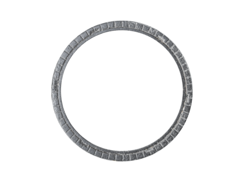 Round ribbed cast iron frame is isolated. The metal is heavily weathered and pitted.