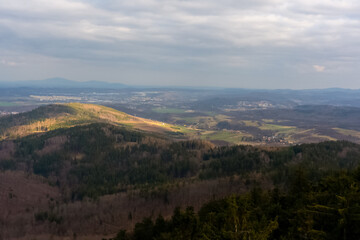 Panoramic view of a countryside landscape seen from a mountain. Concept of rural life, scenic beauty, and peaceful countryside. High quality photo
