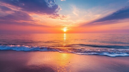 The ocean is calm and the sky is a beautiful orange color