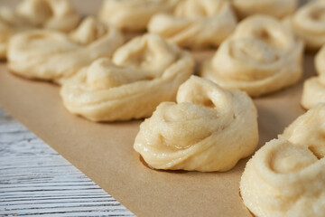 Homemade buns on a baking sheet. Selective focus.