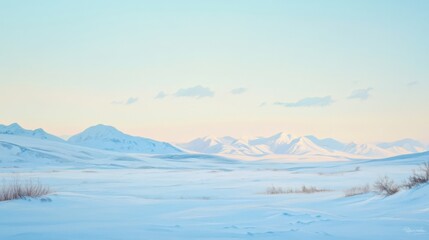 Fototapeta premium A snowy mountain range with a clear blue sky