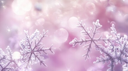 Fototapeta premium Snowflakes on a soft light pink lilac background with a sparkling effect perfect for winter holiday themed decorations