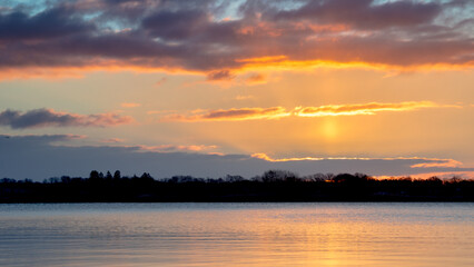 sunrise over the lake, golden hour, golden light, complementary colors, reflections on the water, sun disk, frosty morning, sky, water, sunrise, clouds, landscape, lake, horizon, sun projection