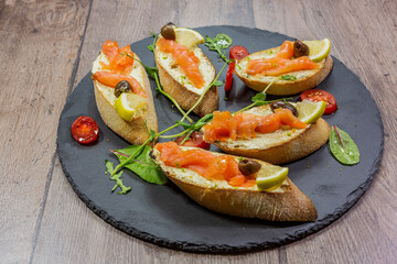 bruschetta with fresh vegetables and fresh meat. 
