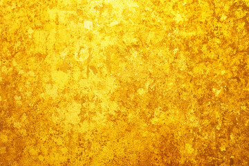 Gold leaf attached to the wall texture background
