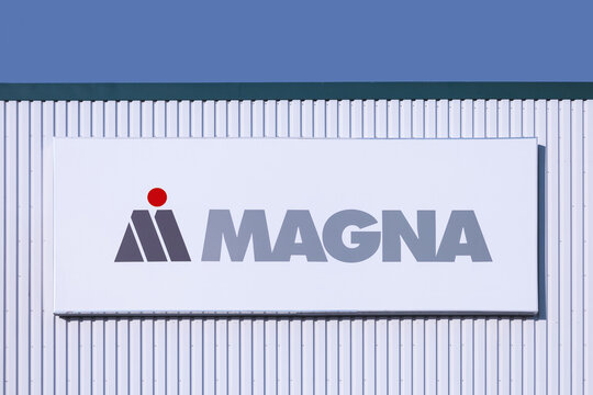 Sady, Poland - September 23, 2024. Magna International Inc. logo on a warehouse. Magna is a large Canadian company supplying automotive components.
