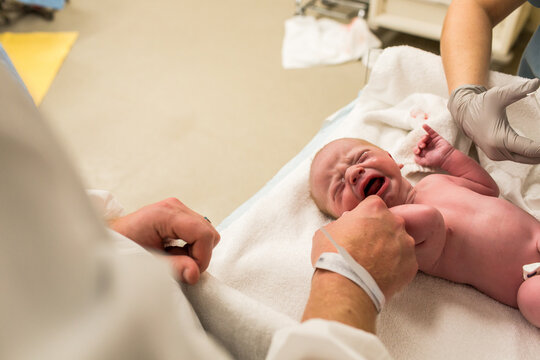 Baby Crying on Hospital Table While Getting Vaccines