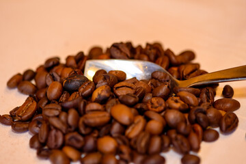 A pile of coffee beans spilled on the table