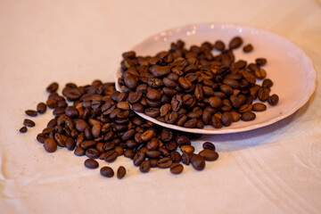 A pile of coffee beans spilled on the table