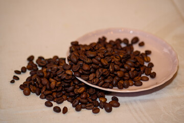 A pile of coffee beans spilled on the table