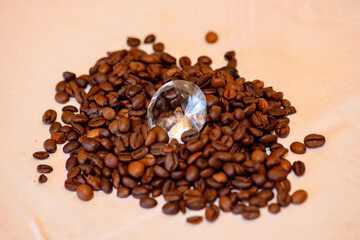 A pile of coffee beans spilled on the table