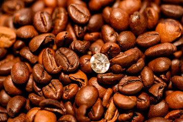 A pile of coffee beans spilled on the table