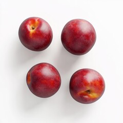 Four shiny red plums arranged on a white background.