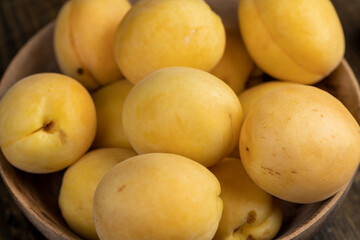 ripe soft apricot fruits on the cutting board