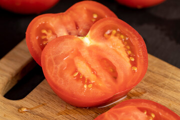 fresh soft tomatoes in drops of water