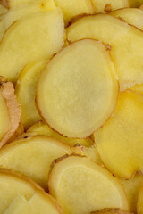 details of the ginger root used in cooking sliced into pieces