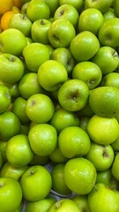 Apples,Plum, peach fruits for sale in the market.A bunch of fresh and ripe fruits are for sale .Fruits stall at fruit market.Fruits backgrounds