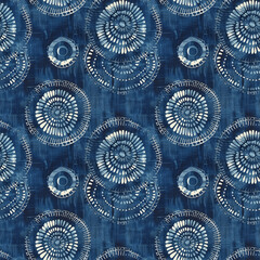 Indigo blue and white batik fabric, seamless circular patterns, incorporating small dots to create intricate designs