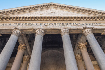 Landmark building facade in Rome. Pantheon pediment and columns. Italy