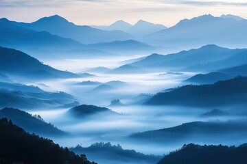 Fototapeta premium A dense blanket of fog spreading over a vast valley, with mountain peaks glittering in the morning light