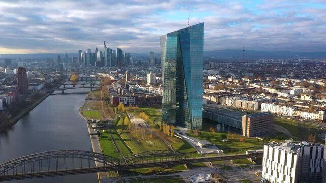 Dolly Flight through and Panorama at Frankfurt am Main, Germany. Skyline, New Skyscrapers, Headquarters of the European Bank, Urban Canyon. Aerial Pedestal in Establishing Drone Shot. Forward movement