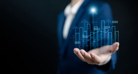 Businesswomen show to arrow up virtual to forecast and analyze the stock market and economic with...