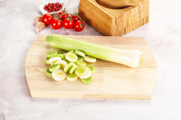Ripe sliced leek over board