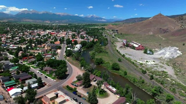 Salida Colorado aerial drone forward motion Collegiate Peaks 14ers S Mountain Tenderfoot Hill Buena Vista Rocky mountain town Chaffee County Arkansas River hiking trails blue sky sunny day noon roads