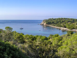 hidden cove with rock beach on the island of Ibiza. High quality photo