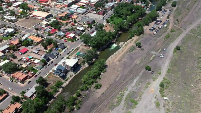 Scout Wave pan down birdseye view river surfing wave aerial drone Salida Colorado surfer left to right turning Arkansas River Buena Vista Collegiate Peaks Tenderfoot Hill mountain town Chaffee County